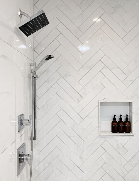 Custom shower ideas. Marble look porcelain herringbone accent shower wall with shower niche and Delta Faucet shower fixtures. Small Restroom Remodel, White Herringbone Shower Tile, Herringbone Bathroom Wall, Herringbone Bathroom Tile, Herringbone Shower Wall, Townhome Bathroom, Herringbone Shower Tile, Master Shower Remodel, Style A Bathroom