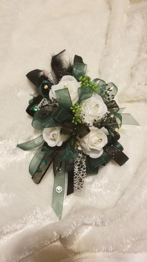 Hunter Green Corsage Prom, Prom Corsage And Boutonniere Emerald Green, Corsage For Emerald Green Dress, Emerald Green Prom Flowers, Green Prom Corsage, Dark Green Corsage, Corsage For Green Dress, Emerald Green And Black Corsage, Green Corsage And Boutonniere