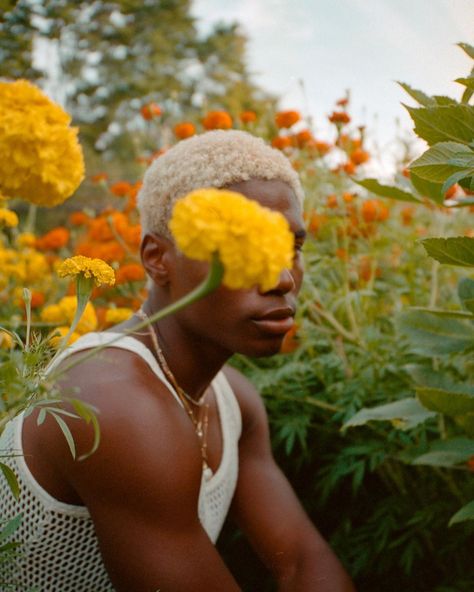 deon on Instagram: “revisiting the art of vulnerability in that of a black boy’s body — shot on my Contax T2, film Portra 400.” Nature Lifestyle Photography, Portraits On Film, Interesting Portrait Photography, Nature Portrait Photography, Man Flowers, Nature Editorial, Nature Shoot, Film Portraits, Garden Photoshoot