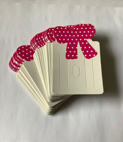 Display cards for hair accessories, bows, clips.  White and pink cardboard display cards with pink spotty bow detail. Good quality cards 8cm long, 5 cm wide. Pack of 50 cards. Bow Display Cards, Hair Bow Display, Packing Idea, Hair Accessories Display, Bow Display, Hang Tag Design, Cardboard Display, Accessories Display, Business Thank You Cards