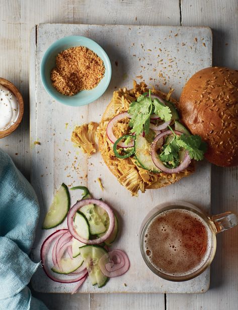 Jackfruit Rendang Burger – A Flavor-Packed Delight! Serves: 4 Ingredients: For the Burger: 2 × 400g tins jackfruit 2 tsp steak seasoning 2 tbsp vegetable oil (divided) 200ml coconut milk 4 tbsp desiccated coconut Salt and black pepper For the Spice Paste: 1 lemongrass stalk 1 onion 3 garlic cloves Thumb-sized piece fresh ginger 1 tsp dried chilli flakes 1 tsp ground turmeric 1 tsp ground cinnamon 1 tsp sugar For the Red Onion Topping: 1 lime 1 red onion ½ cucumber 1 fresh green chilli To ... Desiccated Coconut, Steak Seasoning, Ground Turmeric, Green Chilli, Chilli Flakes, Fresh Green, Fresh Ginger, Ground Cinnamon, 4 Ingredients