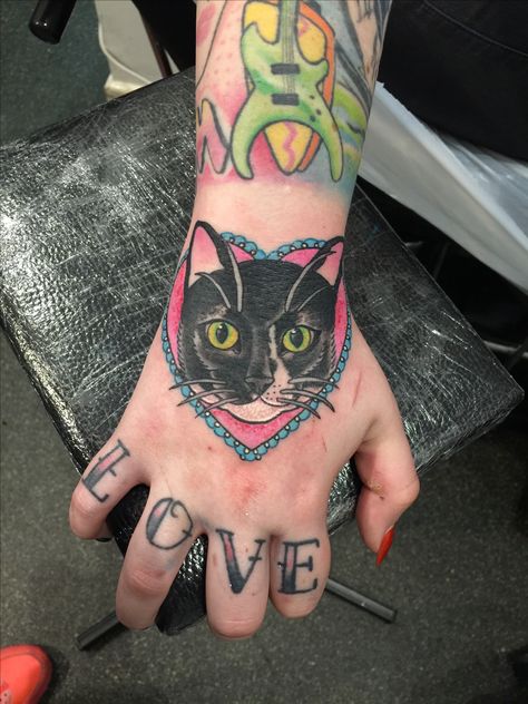 Hand Cat Tattoo, Cat Tattoo On Hand, Cat Chest Tattoo, Black Cat Hand Tattoo, Cat Tattoo Hand, Cat Hand Tattoo, Cat With Bowtie Tattoo, American Traditional Cat Tattoo Black, Cat Print Tattoo