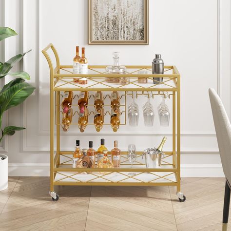 The golden metal frame gives the gold bar cart with wheels a noble appearance. The 2-layer storage design meets basic storage needs and makes the entire bar cart look simple and practical. It is not only a bar cart, but also a dazzling decoration. Home Bar Carts, Bar Cart Cabinet, Shelf Wine Rack, Wine Rack Glass Holder, Wooden Bar Cart, Wood Bar Cart, Modern Bar Cart, Metal Bar Cart, Gold Bar Cart