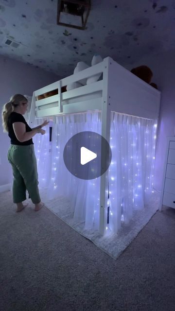 Hannah Crisp on Instagram: "Here is exactly how I hung up these loft bed curtains! So happy with how they turned out. I really think the pinch pleated curtains were key and of course the twinkle lights ✨ 

Comment “links” for links to everything you see sent to your inbox! 🫶🏼 make sure you are following me so you receive your message!

#loftbed #kidsroominspo #girlsbedroom #purplebedroom #tweenbedroom #teenbedroom #toddlerbedroom #curtainlights #twinklelights" Curtain On Loft Bed, 2 Beds Small Room, High Bed With Curtains, Bedroom With Loft Bed Ideas, Hanging Curtains Under Loft Bed, Bottom Bunk Bed Ideas, Diy Bed Curtains, Girls Room With Loft Bed Ideas, Under Cabin Bed Den Ideas