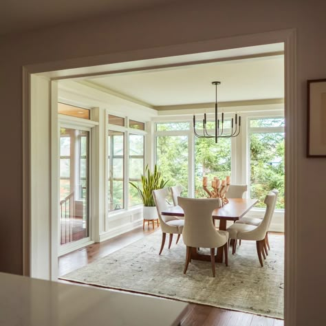 What a difference this addition made to this house, both inside and out! We added about 360 square feet with a new dining room and sun room. . Additions can be tricky, and this one was especially so, with a combination of indoor and semi-outdoor space. With special attention to detail, we designed this addition to be seamlessly integrated with the existing home so that it looks like it's always been there. ______________________________________________ #homeaddition #interior #interiorst... Three Season Porch Dining Room, Screened In Porch Dining Room, Dining Room With Windows All Around, Dining Room In Sunroom, Dining Room With Big Windows, Dining Room Sunroom Combo, Dining Room Bump Out Addition, Dining Room Addition Off Kitchen, Sunroom Dining Room Off Kitchen