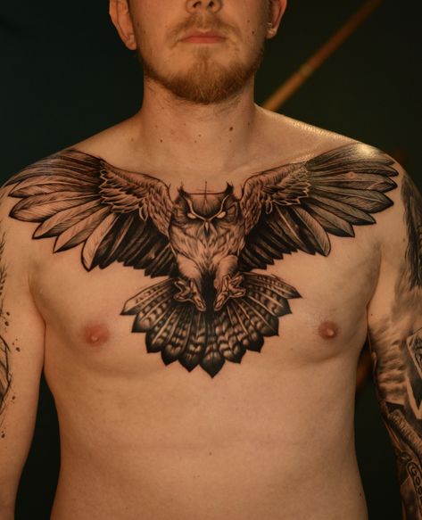 A tattoo idea for a man could be an owl design on the chest. Owls are often associated with wisdom and mystery, making them a popular choice for tattoos. The chest is a great location for a tattoo as it provides a large canvas for intricate designs.      Tattoo Idea Szczecin Poland Owl Animal Spiryt Owl Chest Piece Tattoo, Bird Chest Tattoo Men, Chest Owl Tattoo, Owl Chest Tattoo Men, Bird Chest Tattoo, Owl Tattoo Chest, Szczecin Poland, Owl Animal, Portraits Art