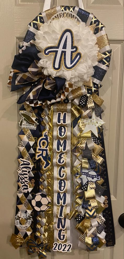 Experience mum creator for all your homecoming needs Sophomore Mum Homecoming, Homecoming Mum Tops, Homecoming Backer Ideas, Mums Homecoming Junior Year, Sophomore Hoco Mum, Medium Mums Homecoming, How To Make A Hoco Mum, Mums Blue And White, Texas Homecoming Mums Freshman