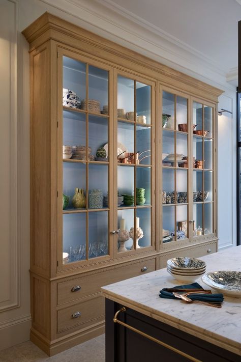 A traditional oak dresser with drawers at the bottom & glazed doors above with a turquoise coloured interior. Turquoise Interior, Oak Display Cabinet, Glazed Doors, Oak Dresser, Kitchen Dresser, Pale Turquoise, Banquette Seating, Oak Kitchen, Glazed Door