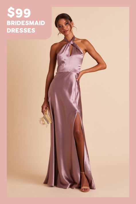 Your wedding will look like a star-studded event with your bridal party wearing this twist-front halter satin bridesmaid dress. The lustrous fabric of this floor-length gown makes each color look rich and regal while the halter style creates an alluring look thats on par with an A-list Hollywood star. We love this bridesmaid dress paired with a low bun that softens the cool, modern style while showing off the neckline.