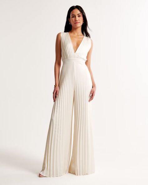 The A&F Giselle Pleated Jumpsuit | Abercrombie & Fitch (US) White Jumpsuits For Women Wedding, Old Money Jumpsuit, All White Cocktail Party Outfit, Bride Outfits Rehearsal Dinners, White Jumpsuit Outfit Classy, Womens Cocktail Attire, Reception Jumpsuit, Sandals Barbados, White Denim Jumpsuit