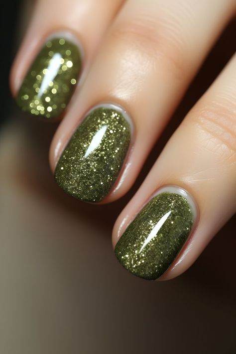 olive green nails, glittery nail designs, nail art ideas, trendy nail styles, manicure inspiration, green nails, sparkly nails, holiday beauty, nail trends, shimmering manicure, glamorous nails, nail aesthetics, stylish nail looks, festive nails, chic nail ideas, nail inspo, glittery green nails, nail perfection, nail goals, glamorous manicure, sparkling nail art, stunning nails, dazzling nail designs, olive green sparkle, holiday season nails Nail Designs Olive Green, Glittery Green Nails, Glittery Nail Designs, Chic Nail Ideas, Glitter Nail Ideas, Olive Green Nails, Glittery Nail, Nail Aesthetics, Nail Goals