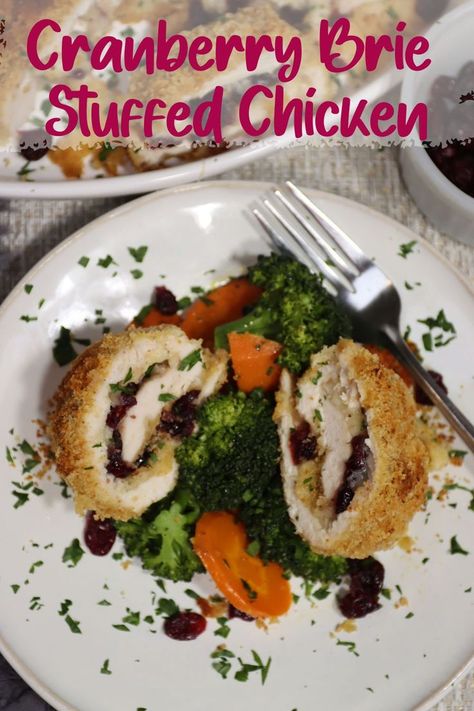 one plate of cranberry brie stuffed chicken with steamed carrots and broccoli with a platter of cranberry brie stuffed chicken in the background. Brie Stuffed Chicken, Chicken Dishes For Dinner, Stuffed Chicken Recipe, Brie Cranberry, Cranberry Baking, Cranberry Brie, Cranberry Chicken, Chicken Eating, Winner Winner Chicken Dinner