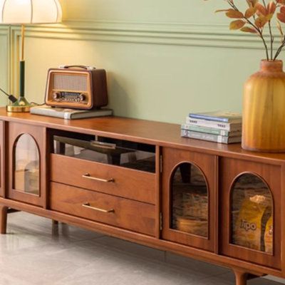 Embrace timeless elegance with this cherry wood TV stand, blending modern vintage charm and superior functionality. It boasts multi-storage spaces within a compact design, offering a sleek solution to keep your living space tidy and stylish. jessica | jessica 78.7" W Storage Credenza 22.8 H x 78.7 W x 15.7 D in / redWood / Glass in Brown | 88" | Wayfair Maximalist Tv Stand, 70s Entertainment Center, Retro Tv Stand Bohemian, Mid Century Tv Console Midcentury Modern, 1970s Tv Console, Mid Century Modern Tv Console Rounded Edge, Vintage Tv Stand, Farmhouse Living Room Decor Ideas, Wood Tv Cabinet