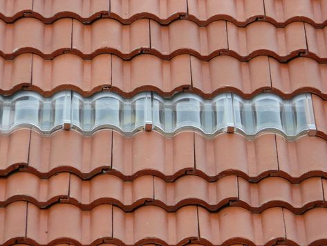 Single line of clear roof tiles Bicycle Garage, Concrete Roof Tiles, Roofing Tiles, Modern Roofing, Tiles Ideas, Tile Companies, Attic Rooms, Concrete Tiles, Roof Tiles