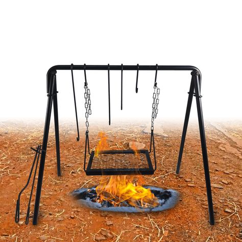 This swing grill is a thing not to miss out on your camping trip, backyard gathering, outdoor parties, or adventure trip. Authentic meals prepared on the open fire just enhance your experience of outdoor activities. Enjoy quality time and delicious meals with your loved ones. Features: Sturdy Material The grill, A-shaped structure, and all the hooks are made of heavy-duty steel material. It increases the structural strength and durability and can withstand high temperatures when uses directly ov Cooking Stand, Camping Bonfire, Outdoor Fire Pit Table, Bonfire Party, Adventure Trip, Fire Cooking, Campfire Cooking, Cooking Accessories, Grill Accessories