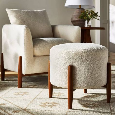 A round sherpa ottoman, so you have somewhere comfy and chic to sit and prop your feet. The wood-accented ottoman stands 18.5 inches tall, making it the perfect height to pair with low-profile MCM couches. Mcgee Target, Target Furniture, Tufted Storage Bench, Upholstered Footstool, Airport Lounge, 42nd Street, Matching Chairs, Round Ottoman, Living Room Sets Furniture