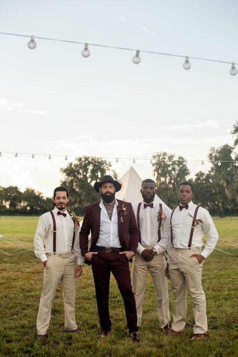 Groom and groomsmen at a glamping-themed, music festival-inspired wedding styled shoot at a rustic ranch venue. #groom #groomsmen #boho #bohostyle #bohowedding #rusticwedding #styledshoot Groom Vest No Jacket, Rustic Wedding Suits Groom Style, Desert Groom Attire, Boho Wedding Tuxedo For Men, Beige Groom Black Groomsmen, Boho Groomsmen Attire Bohemian, Mixed Groomsmen Suits, Groom Suit Boho, Bohemian Groom Attire