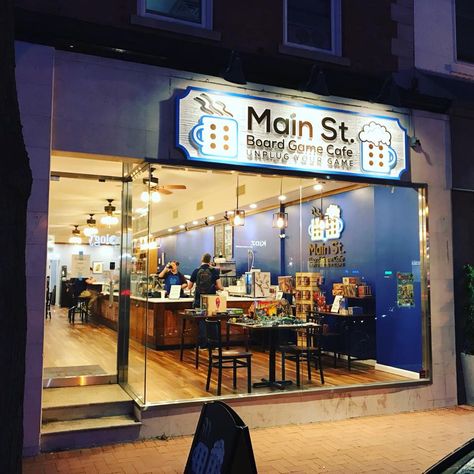 Main Street Board Game Cafe Arcade Coffee Shop, Gaming Coffee Shop, Board Game Cafe Ideas, Board Game Shop, Boardgame Cafe Design, Game Cafe Design, Gaming Cafe Design, Boardgames Cafe, Cafe Design Ideas