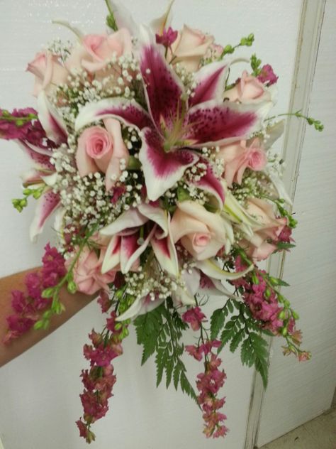 Stargazer lilies, pink roses, larkspur and baby's breath. Made in a bouquet  holder Bouquet Holder, Lily Bouquet, Boquette Flowers, Nothing But Flowers, Flower Therapy, Beautiful Bouquet Of Flowers, Pretty Plants, Baby's Breath, Arte Floral