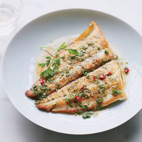 For this healthy fish recipe, chef Kuniko Yagi tops seared sole with a supereasy Thai-inspired sauce that gets vibrant flavor from chiles, lime and cilantro. Get the Recipe with Food & Wine. Hard Recipes, Sole Recipe, Sole Recipes, Sole Fish, Sophie Dahl, Roast Fish, Cooking Fish, Fish Fillets, 75 Hard