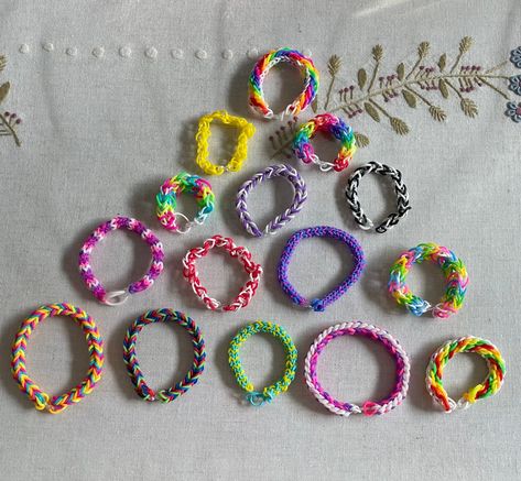 Handcrafted Bracelets made with Rainbow Loom Rubber Bands. Items can be customized. Bracelets With Rubber Bands And Beads, Homemade Bracelets With Rubber Bands, Rainbow Loom Simple Bracelet Tutorial, Loom Bracelets Tutorial Rubber Bands, Bts Inspired Rainbow Loom Bracelets, Christmas Rainbow Loom Bracelets, Rainbow Loom Bracelets Easy, Loom Band Bracelets, Rainbow Loom Rubber Bands