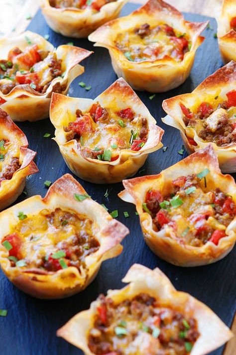 These fun Crunchy Taco Cups are made in a muffin tin with wonton wrappers! Come see why these wonton tacos are our absolute favorite taco recipe! Muffin Tin Tacos Cups, Taco Muffins Cups, Taco Phyllo Cup Appetizers, Southwest Wonton Cups, Chicken Wonton Tacos Recipe, Taco Cups With Corn Tortillas Muffin Tins, Tacos In A Muffin Tin, Mini Taco Cups With Tortillas, Chicken Taco Wonton Cupcakes