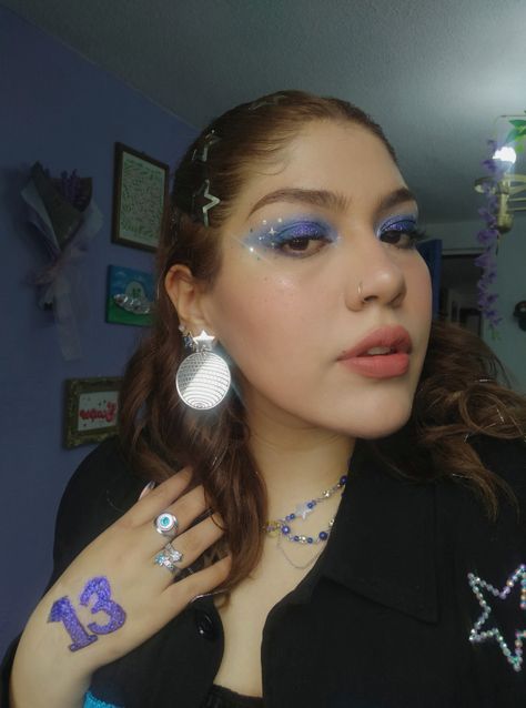 Melissa Hego ✨ Taylor Swift Eras Tour Midnights Era makeup inspired blue glitter and stars ⭐ Midnight Make Up Taylor Swift, Midnights Taylor Swift Aesthetic Makeup, Taylor Swift 1989 Inspired Makeup, Taylor Swift Inspired Eye Makeup, Midnights Outfit Taylor Swift Ideas, Taylor Swift Midnights Era Makeup, Midnight Taylor Swift Makeup, Midnights Era Makeup Ideas, Taylor Swift Midnights Inspired Makeup