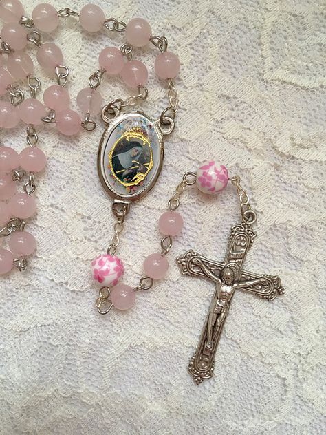 Handmade St. Rita of Cascia rosary beads made with 6mm pink Rose Quartz beads and 8mm ceramic pink & white floral beads. The center and crucifix are both made in Italy. Saint Rita Of Cascia, Rita Of Cascia, Flower Rosary, Saint Rita, St Rita Of Cascia, Pink Rose Quartz, Beacon Of Hope, Pink Ceramic, Rosary