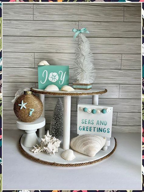 Looking to bring coastal vibes indoors this winter? Check out these 7 winter beach home decor ideas that will transform your space into a seaside retreat. From nautical accents to cozy throws, these decor tips will have you dreaming of sandy shores all season long. Add a touch of the beach to your home with these inspiring ideas! Diy Coastal Christmas Decor, Beach Christmas Decorations Diy, Coastal Christmas Decorations, Beachy Christmas Decor, Seas And Greetings, Ocean Christmas, Toddler Bathroom, Beachy Crafts, Nautical Christmas Ornaments