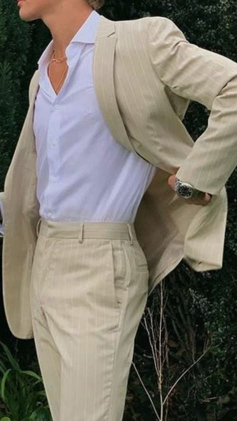 Man is wearing a beige pinstripe suit with a white collard shirt. Mens Suits Graduation, White Formal Men Outfit, Men Suits Beige, Farewell Dress For Men, Fancy Man Outfits, Beige Suit Men Aesthetic, Mens Creme Suit, Farewell Suits For Boys, Pinstripe Wedding Suit