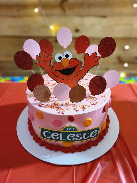 Made by IG @ emerald_cakess Elmo Birthday Party Girl Cake, Elmo Cake Girly, Sesame Street Birthday Party Ideas Food, Girl Sesame Street Birthday, Elmo 2nd Birthday Party, Birthday Cake 1st, Elmo 2nd Birthday, Elmo Birthday Cake, Birthday Party Ideas Food