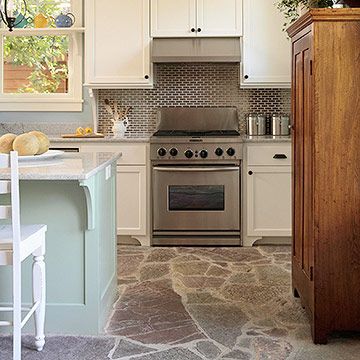 Coastal color and charm can be found throughout this cool, casual kitchen, including underfoot. Rustic flagstone flooring -- in watery blue and green hues -- complements the soft blue of the walls and the soft green of the island base. The flooring is durable and easy to maintain Kitchen Tile Floor, Kitchen Flooring Options, Best Flooring For Kitchen, Casual Kitchen, Kitchen Floor Tiles Ideas, Flagstone Flooring, Rustic Flooring, Floor Ideas, Popular Kitchens