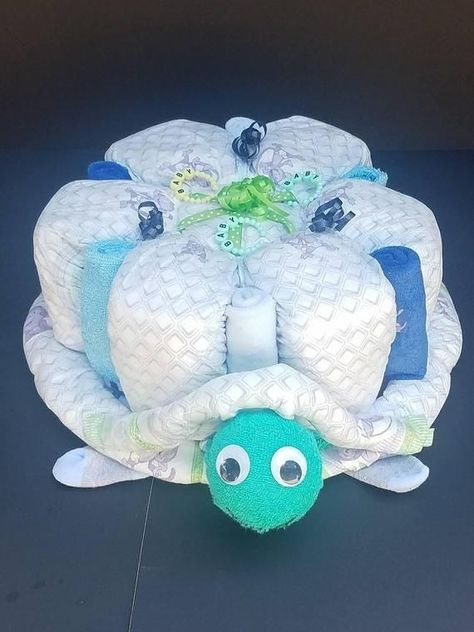 Turtle Baby Shower Decorations, Unique Diaper Cakes, Diaper Bouquet, Turtle Baby Shower, Diaper Cake Centerpieces, Turtle Baby, Diaper Gifts, Baby Shower Baskets, Diaper Cake Boy