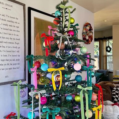 Ali Edwards on Instagram: "Colorful, festive + fun ⭐️. I have so loved switching things up with our tree this year. Most years our tree is a combination of ornaments from my childhood (and others collected throughout my life) and ornaments the kids have collected over the years along with white twinkle lights. I have always loved the nostalgia of that set up + revisiting the stories that go along with so many of those ornaments and I’m sure I’ll do that again in the future. This year I decided to do something completely different (initially inspired by Anna’s request for colorful lights + supported by my 2023 #onelittleword “joy”) and went with a couple boxes of colorful ball ornaments, colored lights, and velvet ribbon tied in bows. I’m so glad Anna pressed + planted that seed to mix thin Colorful Christmas Tree With Ribbon, White Christmas Tree With Colorful Decor, Colorful Ornaments Christmas Tree, Colored Lights Christmas Tree Decorating, Bright Colored Christmas Tree, Ribbon Trees Christmas, Multi Colored Christmas Tree Light Strings, Colored Lights Tree, Kid Friendly Christmas Tree