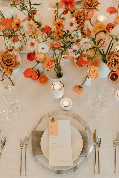 This breathtaking spring wedding at Block 41 will make you swoon! We used delicate spring blooms and a sophisticated color palette, as well as marble accents like chargers and candleholders to elevate the design. We also incorporated bright citrus touches on the tables themselves. See more from this stunning wedding editorial over on our blog. Photo by Jessica Woods Sunset Wedding Colors, Wedding Head Table, Orange Wedding Themes, Orange And Pink Wedding, Wedding Color Palette Summer, Orange Wedding Colors, Wedding Color Pallet, Citrus Wedding, Spring Wedding Colors