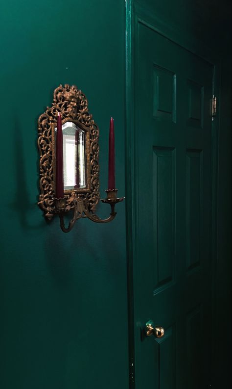 Small gilded antique mirror in a dark forest green hallway with two maroon candles Emerald Green Gothic Bedroom, Dark Green Walls Light Green Ceiling, Green Gothic Bedroom, Green Maximalism, Dark Green Hallway, Forest Room Decor, Moody Rooms, Asian Bedroom, Moody Rustic