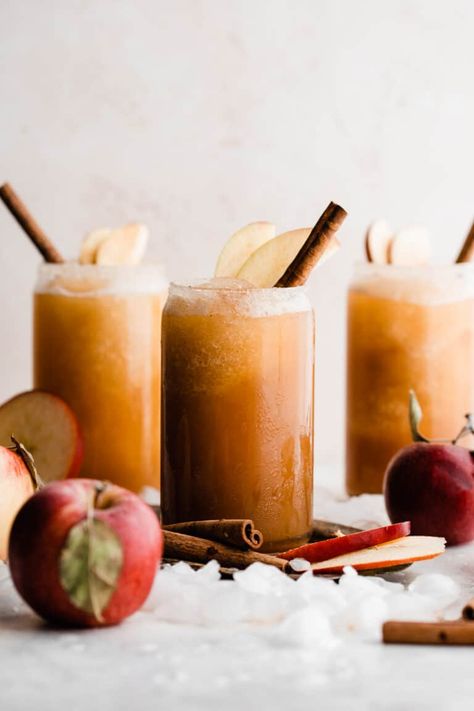 Apple Cider Slushies are the easiest drink to whip up this fall! Both frozen and fresh apple cider are blended together, along with cinnamon, vanilla, and a splash of maple syrup, to make a delicious crowd-pleasing drink. #applecider #appleciderslushies #slushy #fallrecipes #blenderrecipes #easyrecipes #glutenfreerecipes #gamedayrecipes #bluebowlrecipes | bluebowlrecipes.com Apple Cider Slushies, Apple Cider Drink, Cider Drinks, Liquid Sunshine, Freezing Apples, Slushie Recipe, Apple Cider Recipe, Apple Brandy, Winter Cocktails