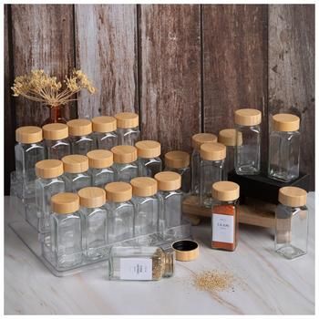 Dimensions: 4.33" H x 1.82" W x 1.82" D Volume: 4 Ounces (118mL) Material: Glass, Paper & Wood Color: Clear, Beige, White & Black Care & Safety: Food Safe, Dishwasher Safe Glass Jar Only; Do Not Microwave Quantity: 24 Spice Jars, 24 Lids & 72 Stickers Manage your pantry with the help of these Glass Spice Jars. Each jar has a tall, squared body with an easy-pour spice guard and a bamboo lid that screws on the top. They also come with sheets of sticker labels so you can keep track of what you've p Small Spice Jars, Large Spice Jar Organization, Spice Jar Organization, Clear Spice Jars, Aesthetic Spice Jars, Spice Jars Amazon, Bridal Shower Wishes, Cottagecore Spice Jars, Ingredients Photography