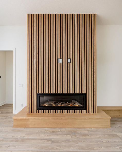 ALT Design Studio on Instagram: “Home is where the hearth is. 🙌🏡 This custom designed wood slat fireplace really warms up the place. ✨❤️ #interiors #homedesign…” Ribbon Fireplace With Tv, Wood Slat Fireplace, Slat Fireplace, Chimney Makeover, Gold Fireplace, Fireplace Feature Wall, Living Room Wall Units, Freestanding Fireplace, Ideas Hogar