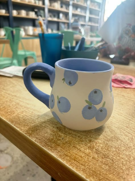 #blueberries #pottery #painting Blueberry Ceramic Mug, Couples Ceramic Painting, Coffee Mug Painting Ideas Easy, Mug Art Paint Simple, Pottery Painting Outfit Ideas, Drawing On Mugs Ideas, Crockadoodle Ideas Pottery Painting, Pottery Cup Painting Ideas Easy, Pottery Place Ideas Painting