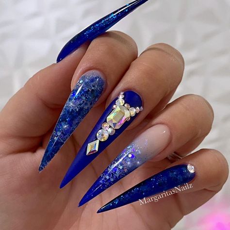 Royal blue ombré stiletto nails ombré and bling design by MargaritasNailz  #glitternails#whitenails#coffinnails#ombrenails#MargaritasNailz#whiteombre#nailfashion#nailswag#nailpro#nailedit#rosegold#royalblue#nailsofinstagram#weddingnails#nailaddict#valentinomargaritasnailz#instagramnails#nailporn#winternails#fallnails#nailtrends#modernsalon#unicornnails#naildesigns#bluenails#pinkandwhite#blingnails#nailart#pearlnails#nudenails Blue Stilleto, Royal Blue Nails Designs, Blue Stiletto Nails, Acrylic Nails Stiletto, Blue Stilettos, Royal Blue Nails, Pointy Nails, Nails Stiletto, Blue Acrylic Nails