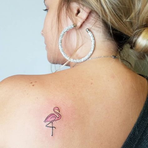 If you're not ready to commit to a major tattoo, we have over a hundred small tattoo ideas and inspiration photos to get you started on a smaller scale. Flamingo Motherhood Tattoo, Flamingo Hand Tattoo, Flamingo Wrist Tattoo, Tiny Flamingo Tattoos For Women, Pink Flamingo Tattoo Ideas, Flamingo Tiny Tattoo, Flamingo Minimalist Tattoo, Small Pink Flamingo Tattoo, Flamingo Tattoo Placement