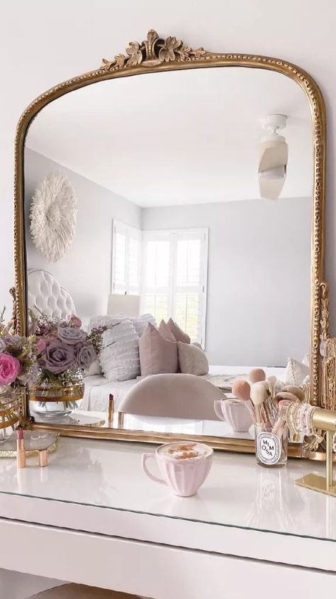 To help you organize your vanity, we've rounded up 14 beautiful vanities with inspiring storage solutions. It's easy to make your getting-ready space shine in just a few simple steps. #Vanity #VanityIdeas #VanityDecor #TheSpruce Mirror In Front Of Window Bedroom, Dresser Into Makeup Vanity, Vanity Decor Aesthetic, Vanity Inspo Aesthetic, Mirror On Dresser, Vanity Storage Ideas, Dorm Vanity, Vanity Organization Ideas, Beautiful Vanities