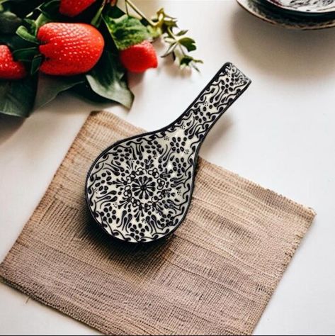 🌸 A delicate place for your spoon to rest while you cook! Our handmade ceramic spoon rest features intricate raised relief designs in elegant black-and-white patterns, bringing both style and function to your kitchen. Inspired by traditional motifs, each piece is crafted with care, making it timeless and unique. Let your spoon rest on this beautiful piece while you focus on creating your next meal. A perfect blend of artistry and practicality, ready to adorn your kitchen space. Get yours no... Spoon Holders, Spatula Holder, Handcrafted Pottery, Kitchen Spoon, Screen Painting, Ceramic Spoon Rest, Meal Preparation, Traditional Tile, Turkish Ceramics