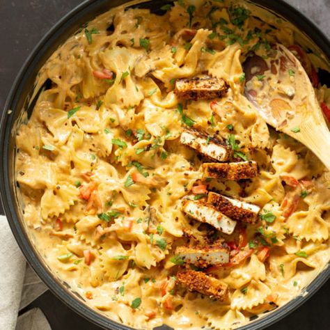 Vegan Creamy Cajun Pasta with Crisp Breaded tofu. Nut-free Creamy Cajun Spice Sauce with Farfalle and Breaded Tofu. #Vegan #Nutfree #Recipe. #Soyfree #option #VeganRicha #VeganCajunPasta Cajun Pasta Sauce, Cajun Cream Sauce, Lemon Asparagus Pasta, Creamy Cajun Pasta, Breaded Tofu, Cafe Recipes, Cajun Sauce, Tofu Vegan, Cajun Spice