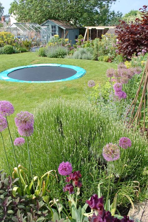 Fun multi-use garden Family Friendly Garden, Sunken Trampoline Garden, Kid Friendly Garden, Child Friendly Garden, Sunken Trampoline, House England, Playground Landscaping, In Ground Trampoline, Backyard Trampoline