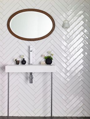 Monastir White Gloss tiles. New format which is perfect for herringbone! | Mandarin Stone Fishbone Tiles, Backsplash Herringbone, White Herringbone Tile, Wallpaper In Bathroom, Baños Shabby Chic, Herringbone Wall, Chevron Tile, White Bathroom Tiles, Chevron Wallpaper