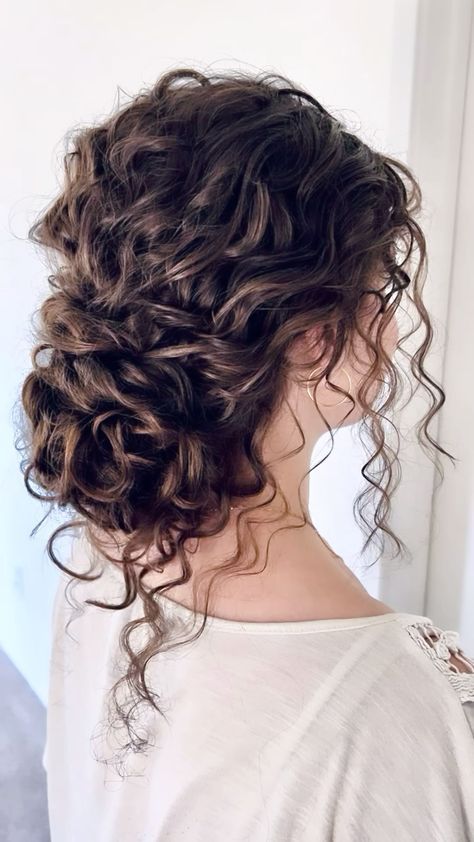 Low Bun With Curls Wedding Hair, Curly Bun Bridesmaid, Updos On Curly Hair, Up Do Curly Hairstyles Wedding, Curly Brown Wedding Hair, Wedding Curly Bun Hairstyles, Elegant Curly Wedding Hair, Bridal Style For Curly Hair, Curly Wavy Updo