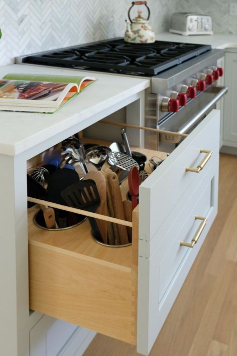 Double drawer pulls out to reveal stainless steel canisters for cooking tools. Oil And Vinegar Bottles, Cooking Utensil Organization, Kitchen Wardrobe Design, Living Room Dining Room Combo, Appliances Design, Living Room Designs Small Spaces, Kitchen Redesign, Utensil Storage, Quartzite Countertops