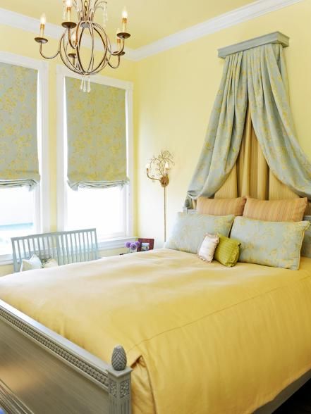 Pink isn't the only choice for a bedroom fit for a princess: Yellow is an unexpected, but undeniably rich option as well. "This south-facing bedroom called out for washing the walls in buttery yellow," says designer Brian Dittmar. "The result is a room that just makes you feel happy. The Swedish-style bed — complete with a corona — plus an aged gold chandelier with crystal accents and pops of pale blue, green and pink give this space a decidedly traditional, but very warm and welcoming feel.... 10x10 Bedroom, Light Yellow Bedrooms, Yellow Bedroom Walls, Bedroom Paint Colors Master, Yellow Bedroom Decor, Yellow Room, Yellow Living Room, Yellow Bedroom, Bedroom Paint Colors